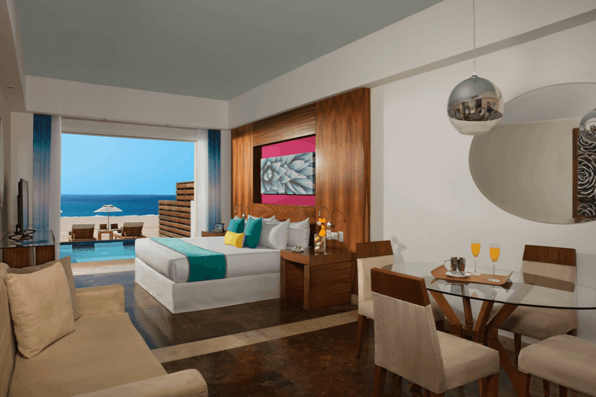 Altitude Junior Suite Swim Out oceanfront at Krystal Grand Los Cabos with direct pool access, terrace and Sea of Cortes view.